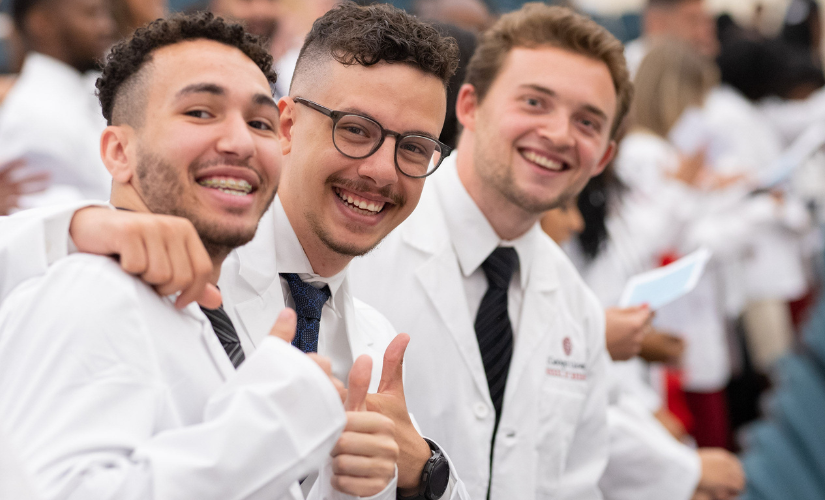 Students celebrating White Coat Ceremony