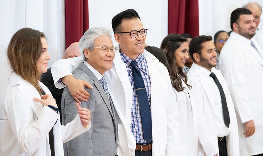 St. George's University School of Medicine students receiving their white coats at the August 2019 White Coat Ceremony