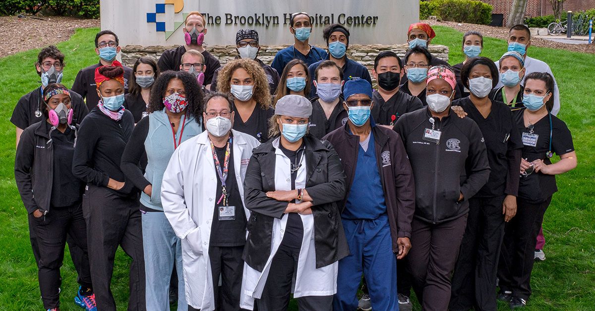Group portrait of The Brooklyn Hospital Center (TBHC) team, including doctors, nurses, and staff News